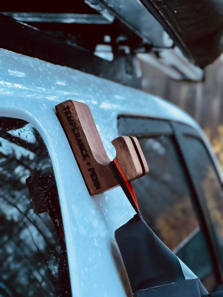 GearHook magnetic holder closeup attached to a vehicle, helping waders stay clean and dry out. Ideal for anglers, campers, and outdoor enthusiasts seeking versatile storage solutions