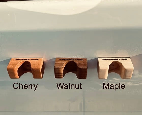 HandleHitch Magnetic Bike Holders in walnut, cherry, and maple finishes – perfect for keeping bikes steady after removing them from Thule, Yakima, or OneUp racks.