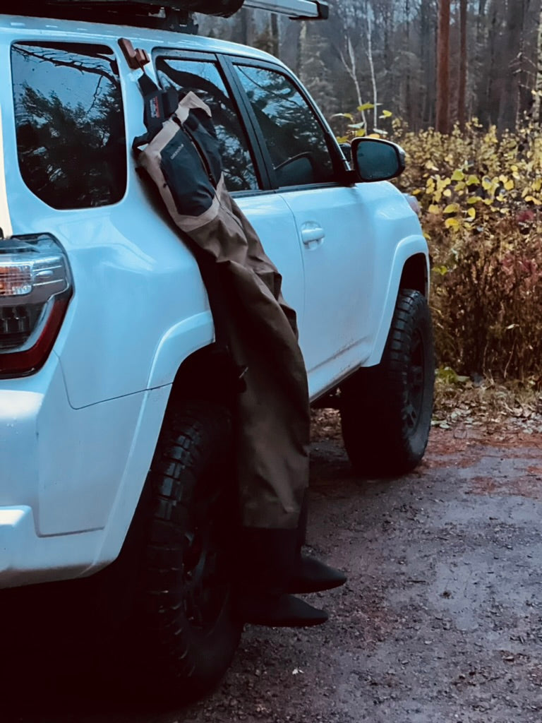GearHook magnetic holder attached to a vehicle, helping waders stay clean and dry out. Ideal for anglers, campers, and outdoor enthusiasts seeking versatile storage solutions