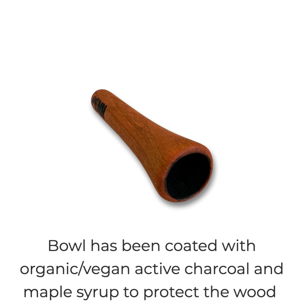 Close-up of The Penn One-Note Fish Whistle, a handcrafted wooden smoking pipe designed for fly fishing anglers and 420 enthusiasts. The bowl is coated with organic, vegan active charcoal and maple syrup to protect the wood, enhancing durability and flavor. A sleek, minimalist design makes it the perfect pocket-sized companion for cannabis-friendly fishing trips.