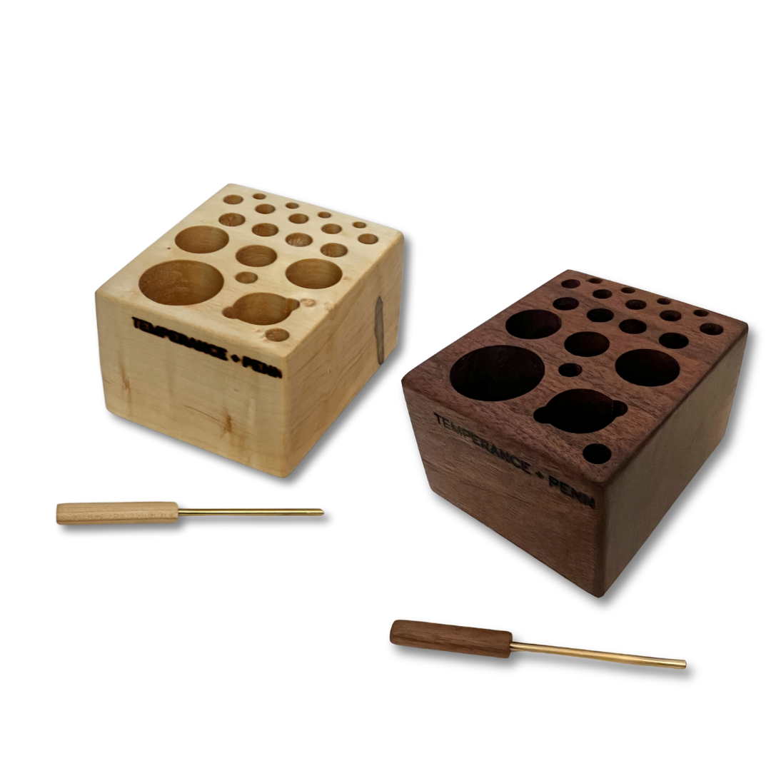 Handcrafted walnut and Maple fly tying tool organizer by Temperance & Penn, designed to store your favorite fly tying supplies, including spools, scissors, and adhesives. Compatible with Dynaking, Regal, Norvise, and Renzetti vises. Perfect for anglers seeking a sustainable and stylish fly tying station."