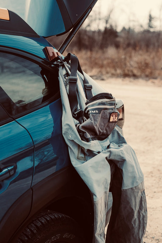 GearHook magnetic holder attached to a vehicle, securely organizing various outdoor tools and gear, ideal for anglers, campers, and outdoor enthusiasts seeking versatile storage solutions.